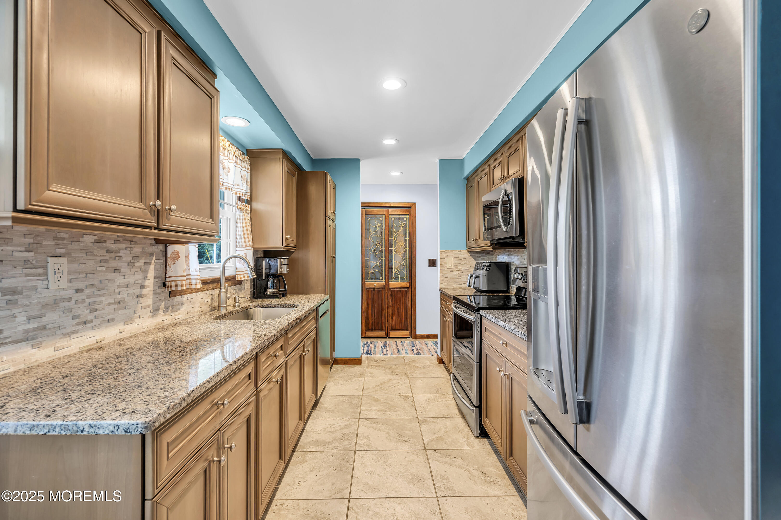 1759 Burrsville Road Brick, NJ 08724 - Photo 5 of 18 a large kitchen with stainless steel appliances granite countertop a refrigerator and a sink