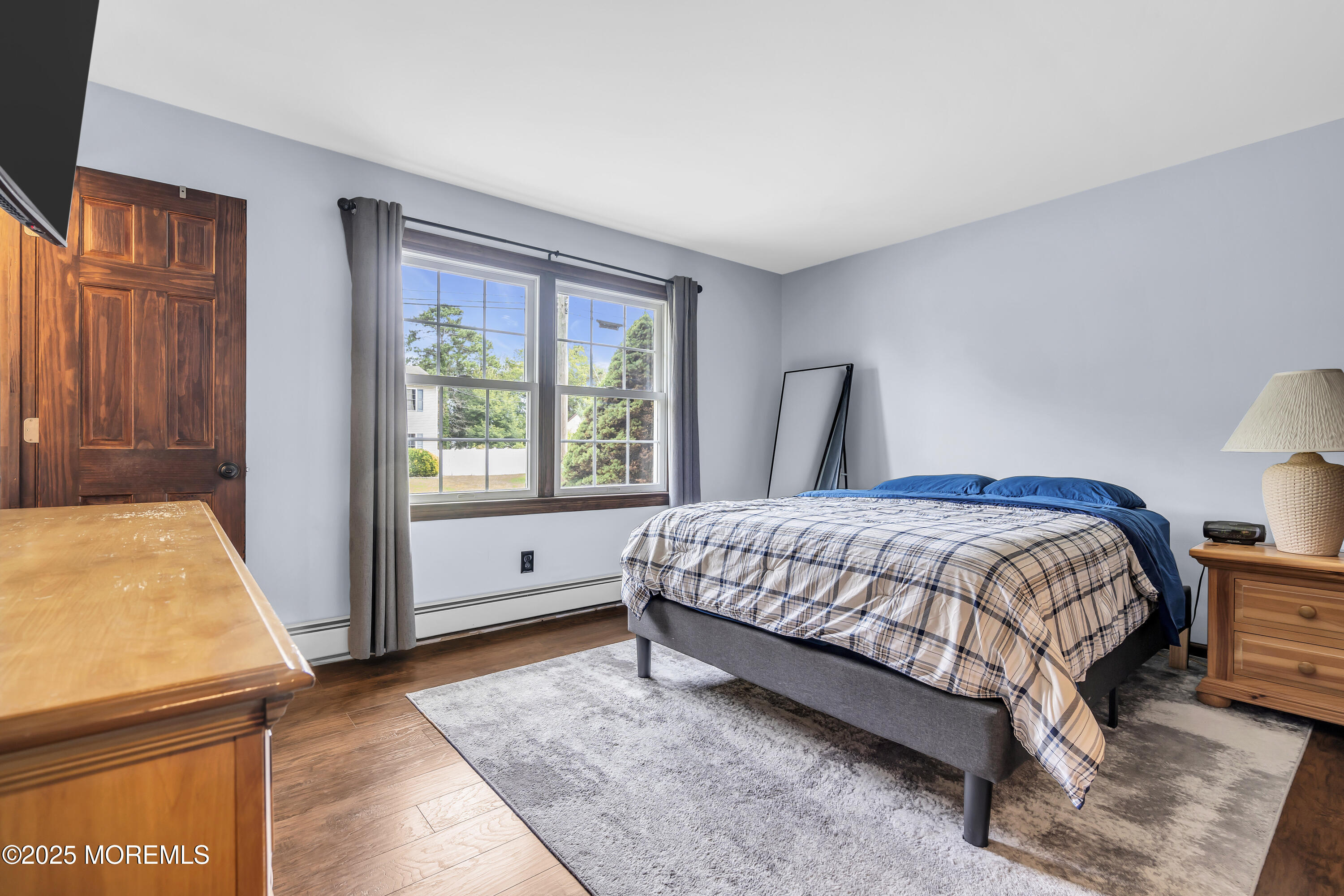 1759 Burrsville Road Brick, NJ 08724 - Photo 10 of 18 a bedroom with a large bed and a window