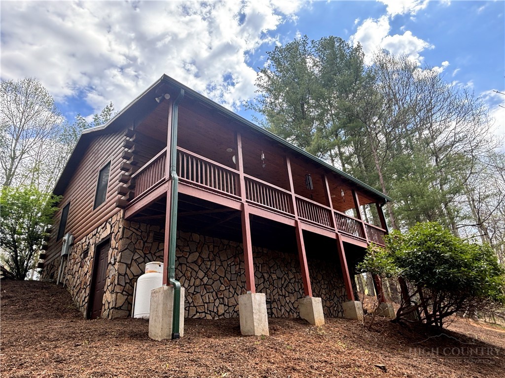 150 Turkey Ridge Crumpler, NC 28617 - Photo 7 of 40 a front view of a house with a tree