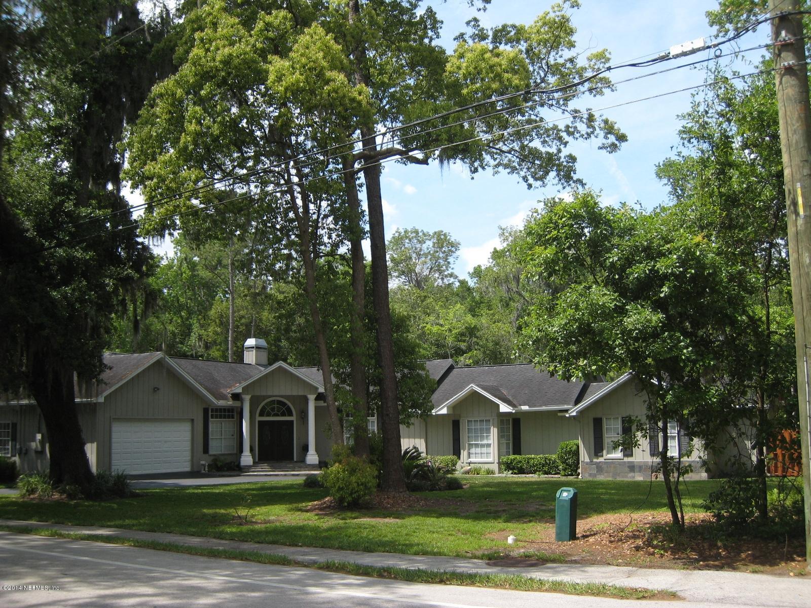 11636 Mandarin Road Jacksonville, FL 32223 - Photo 1 of 41 a front view of a house with a garden
