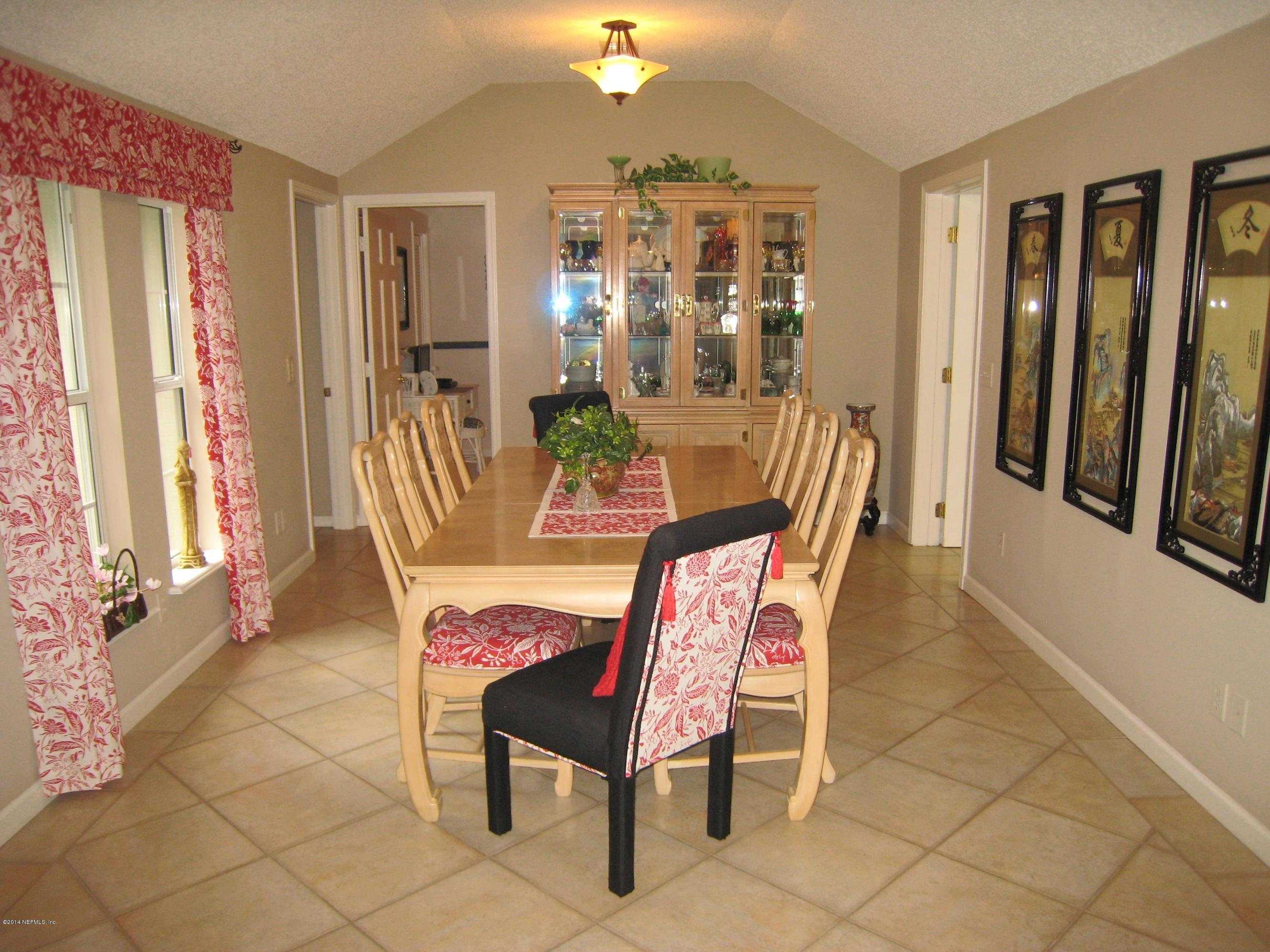11636 Mandarin Road Jacksonville, FL 32223 - Photo 18 of 41 a dining room with furniture and window
