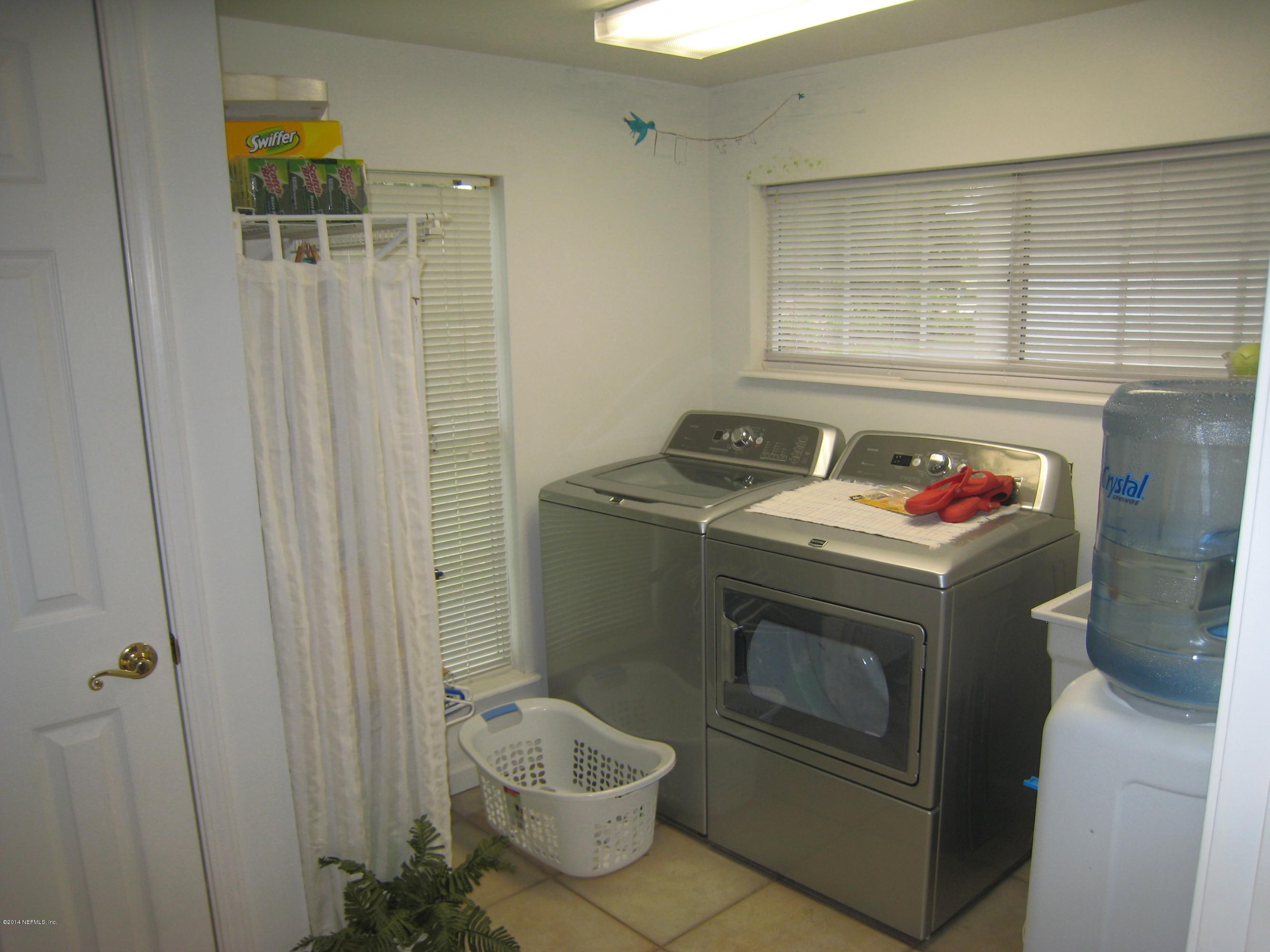 11636 Mandarin Road Jacksonville, FL 32223 - Photo 28 of 41 a utility room with dryer and washer