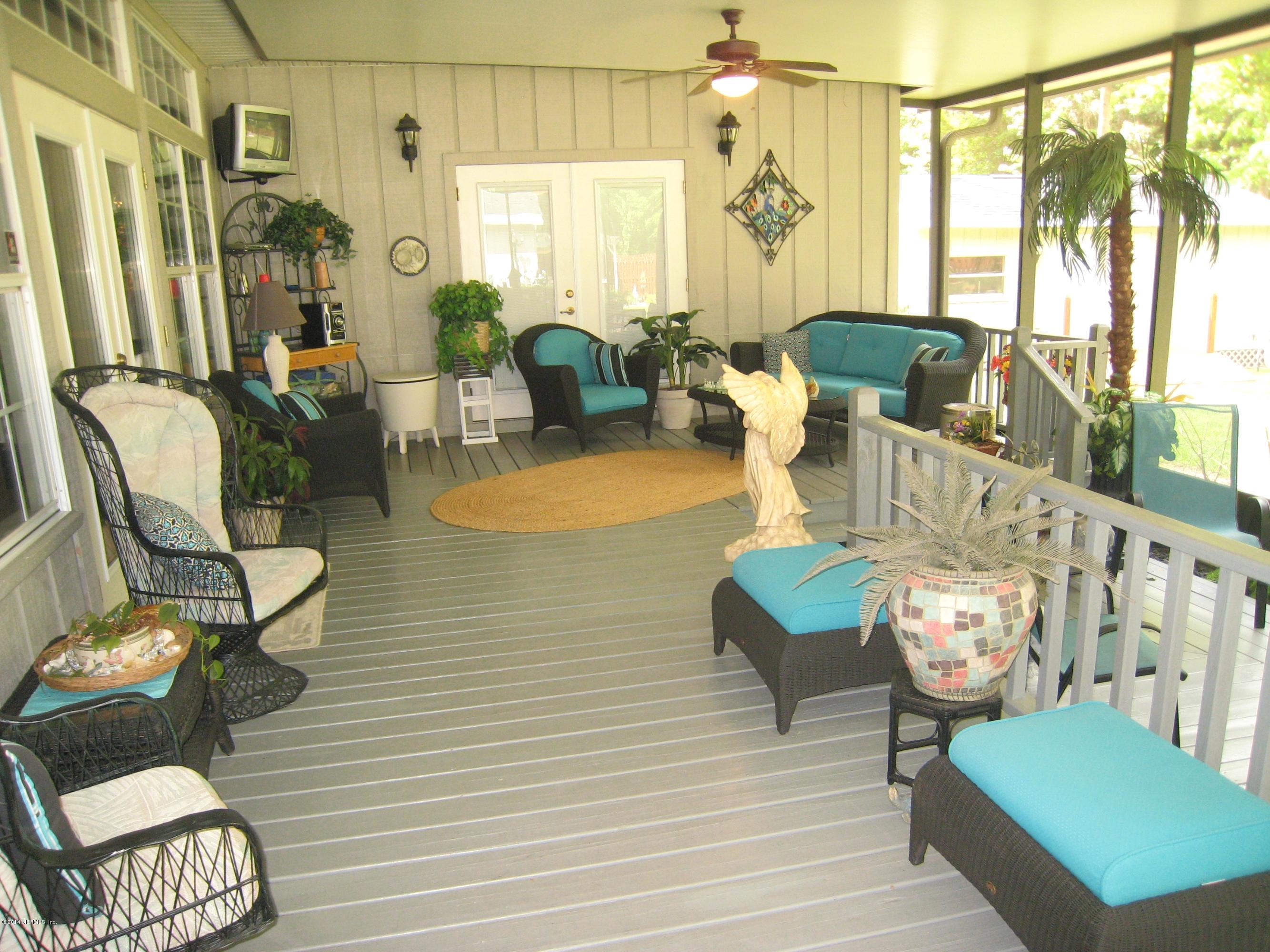 11636 Mandarin Road Jacksonville, FL 32223 - Photo 29 of 41 a living room with furniture and a large window