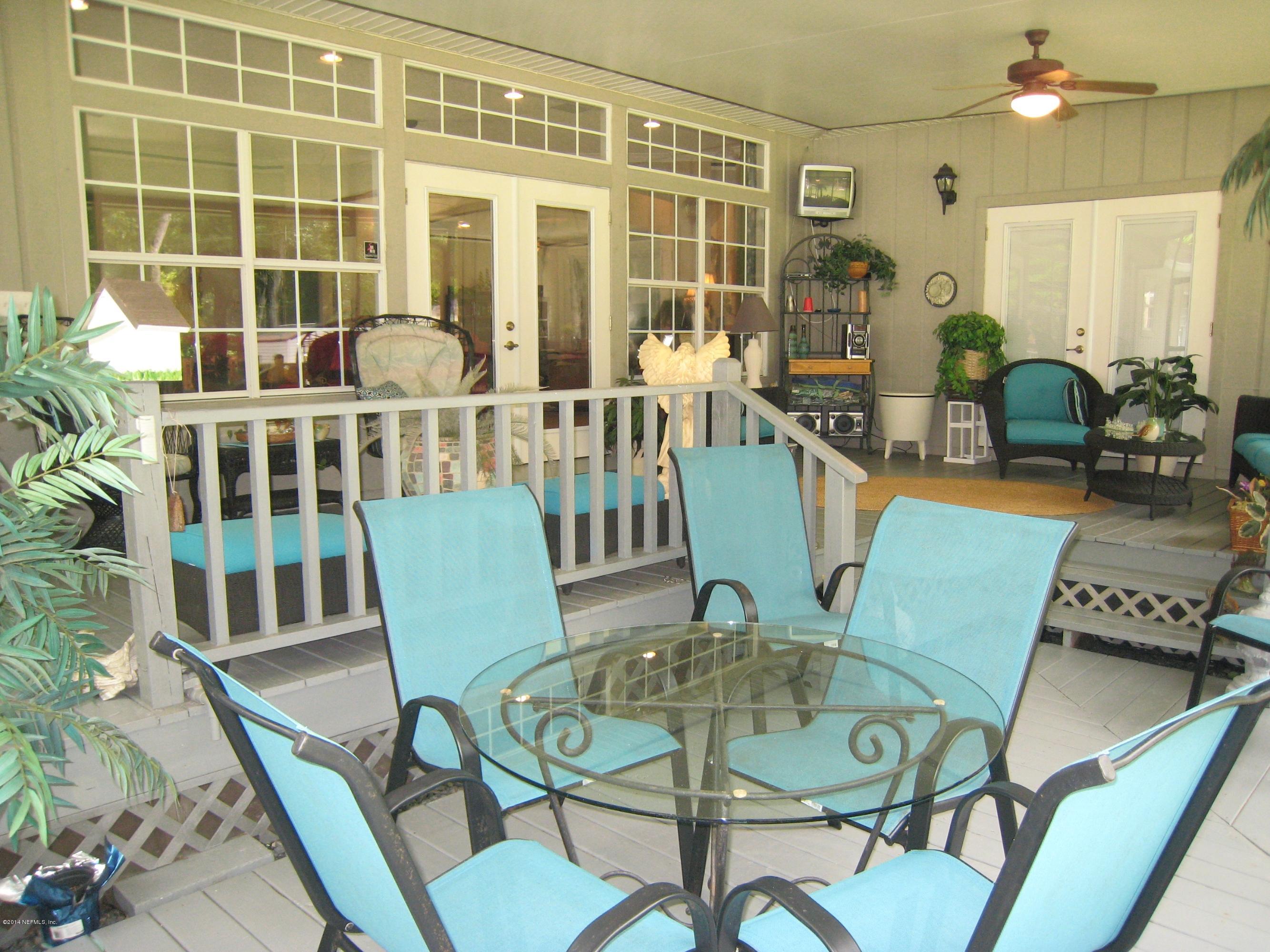 11636 Mandarin Road Jacksonville, FL 32223 - Photo 30 of 41 a view of a dining room with furniture window and wooden floor