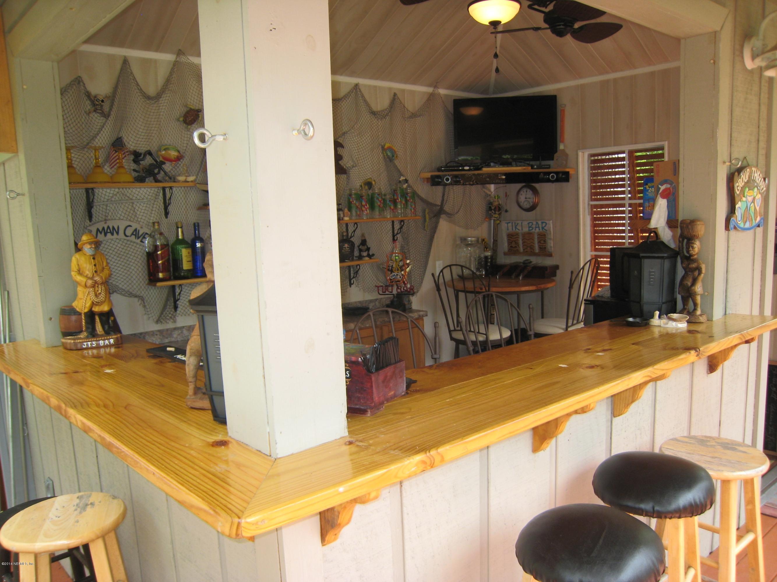 11636 Mandarin Road Jacksonville, FL 32223 - Photo 34 of 41 a kitchen with a sink and a refrigerator