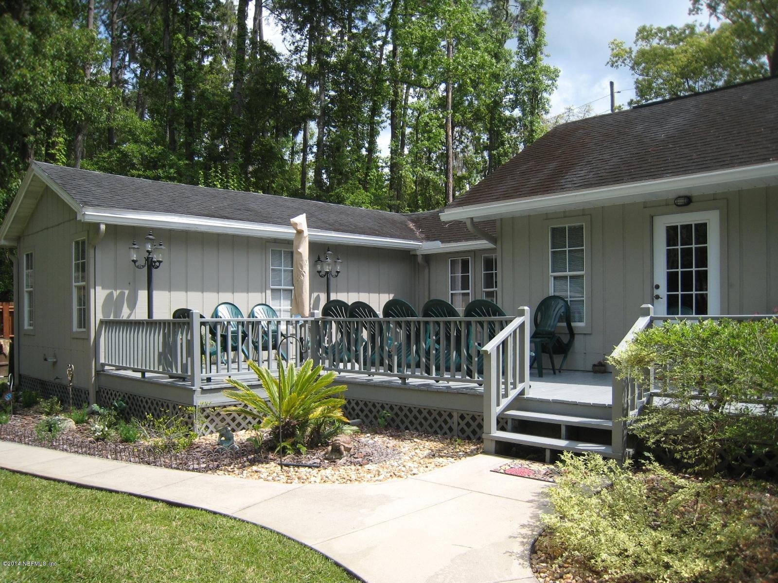 11636 Mandarin Road Jacksonville, FL 32223 - Photo 36 of 41 a front view of a house with garden
