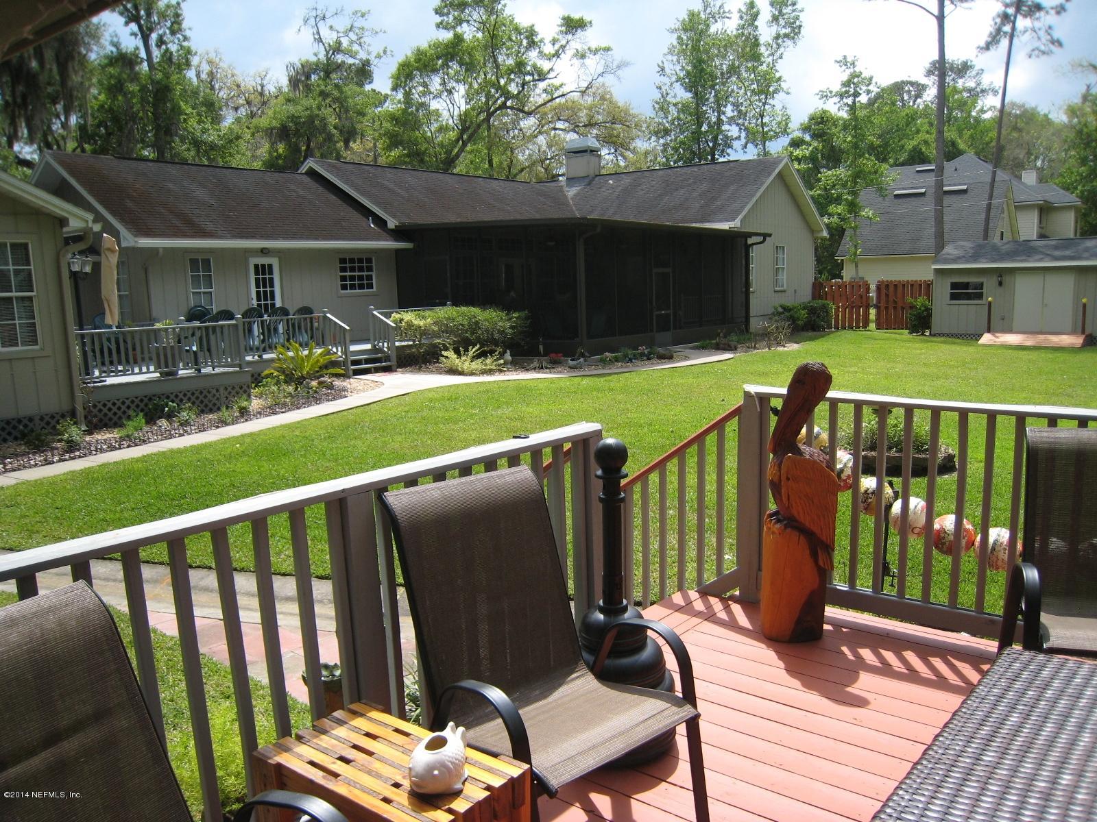 11636 Mandarin Road Jacksonville, FL 32223 - Photo 38 of 41 a view of a house with backyard and porch