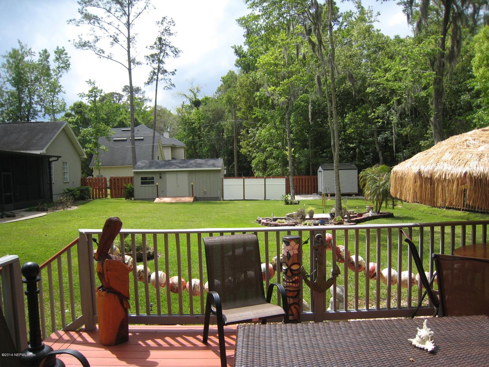 11636 Mandarin Road Jacksonville, FL 32223 - Photo 39 of 41 a view of a wooden deck with a yard