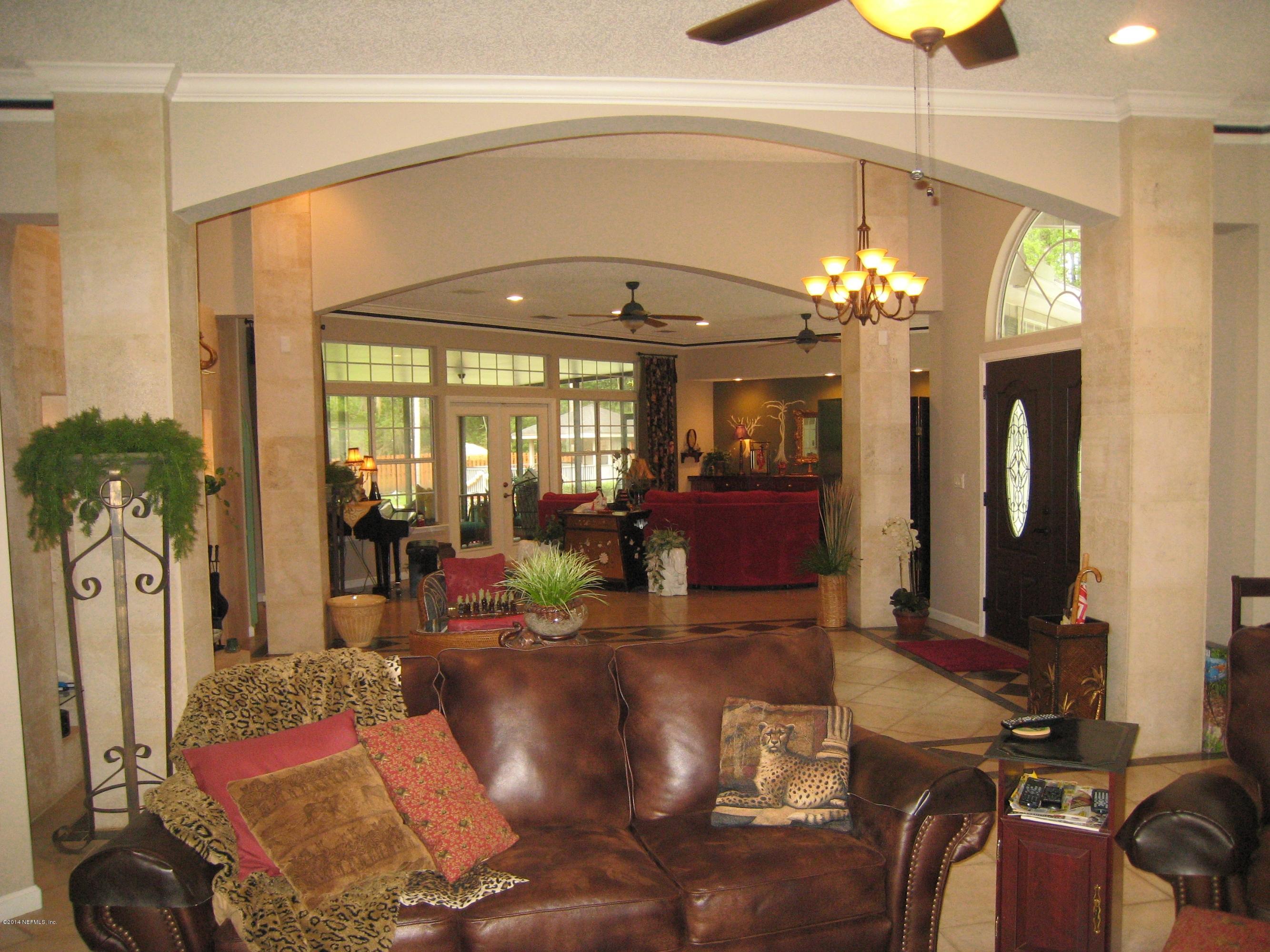 11636 Mandarin Road Jacksonville, FL 32223 - Photo 4 of 41 a view of a dining room with furniture