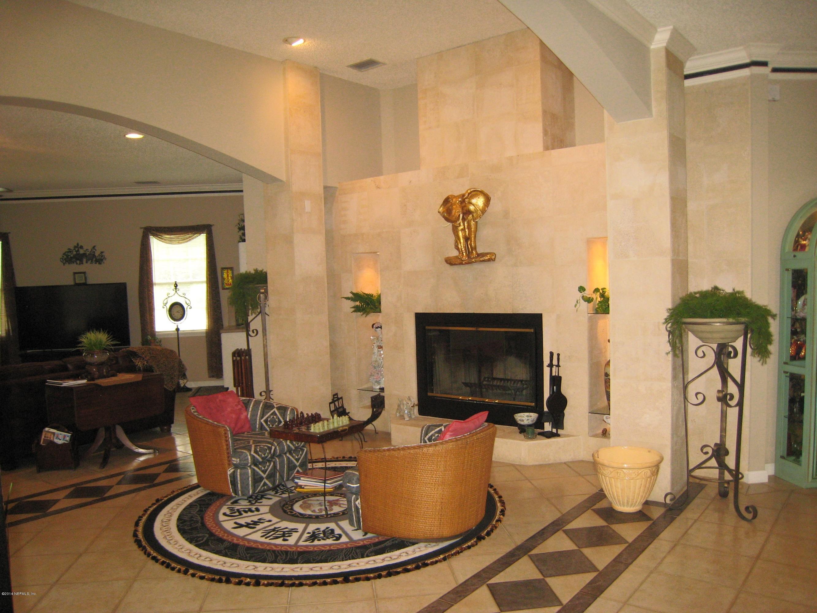 11636 Mandarin Road Jacksonville, FL 32223 - Photo 5 of 41 a room with a table and chairs