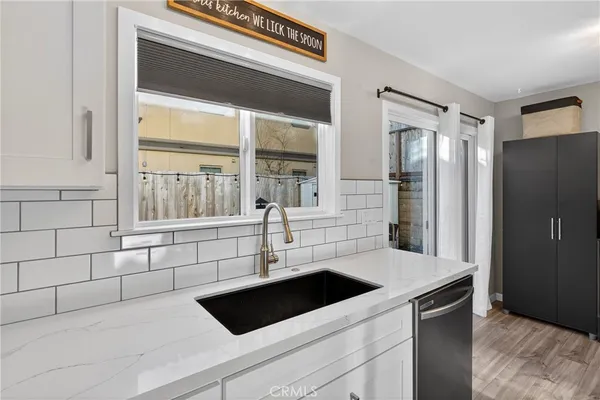 a kitchen with a sink and a refrigerator