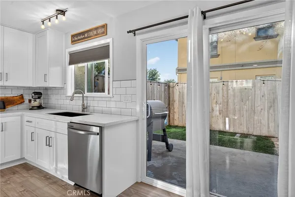 a kitchen with a sink and a window