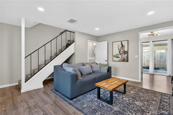 a living room with furniture and a rug