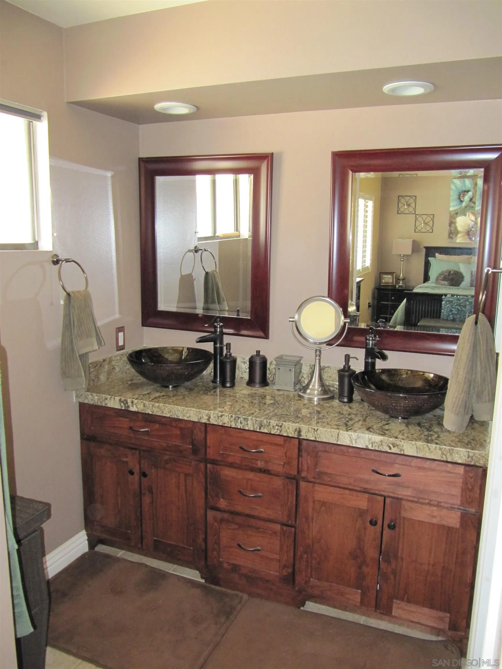 13236 Poway Hills Drive Poway, CA 92064 - Photo 12 of 19 a bathroom with double vanity and two mirror