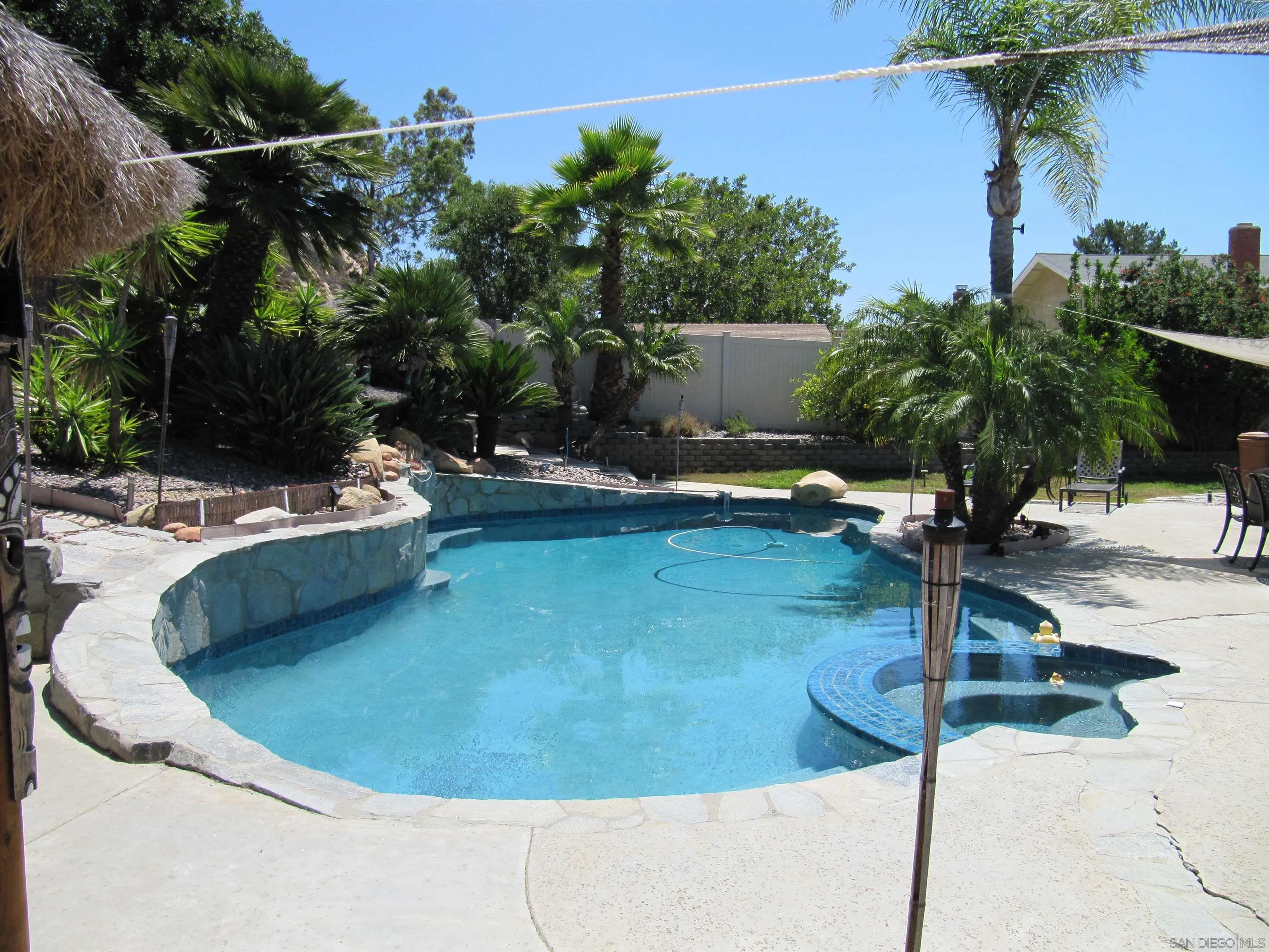 13236 Poway Hills Drive Poway, CA 92064 - Photo 16 of 19 a view of a swimming pool with a patio
