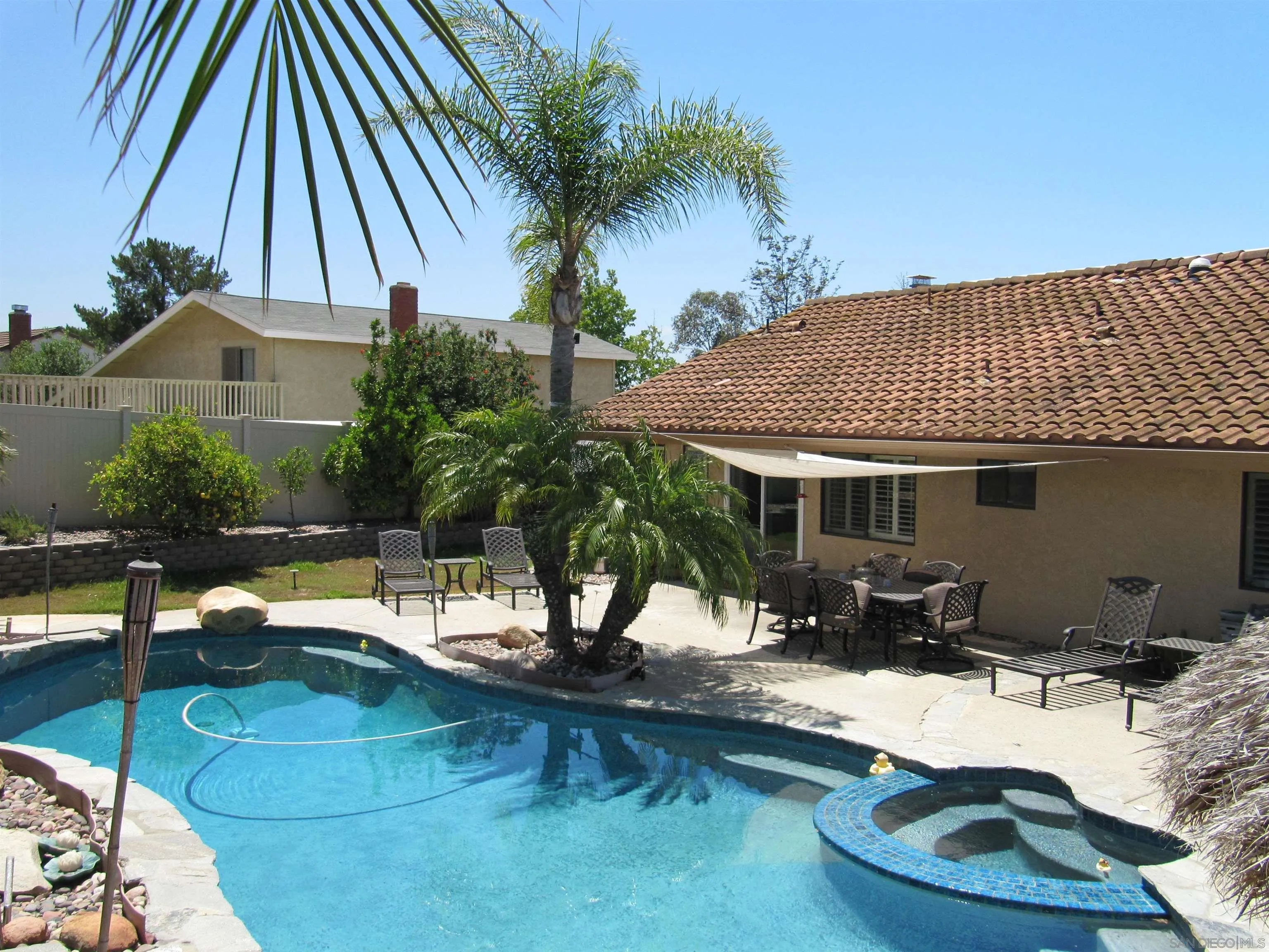 13236 Poway Hills Drive Poway, CA 92064 - Photo 17 of 19 a view of a house with swimming pool and sitting area