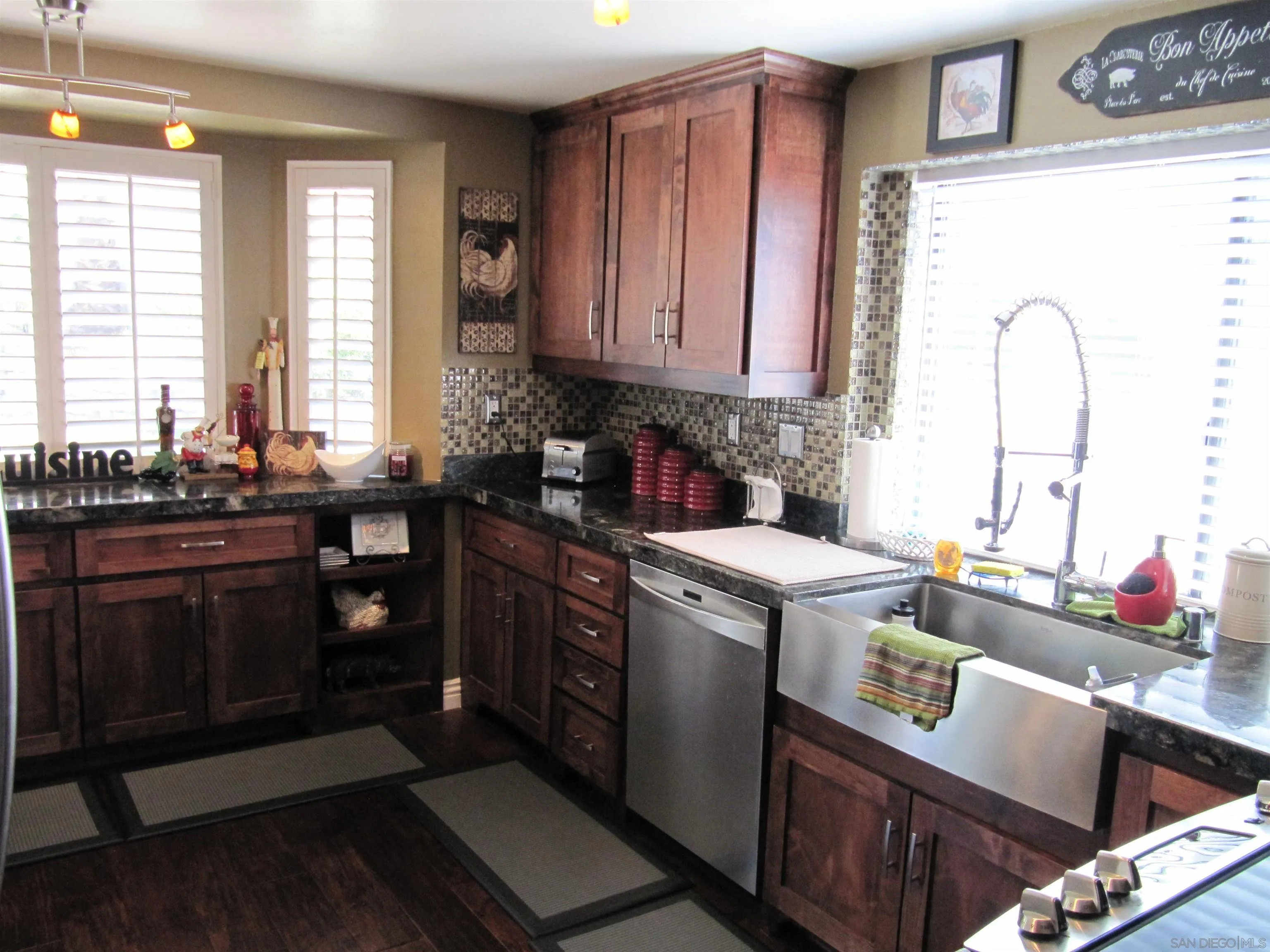 13236 Poway Hills Drive Poway, CA 92064 - Photo 6 of 19 a kitchen that has a sink and a stove in it