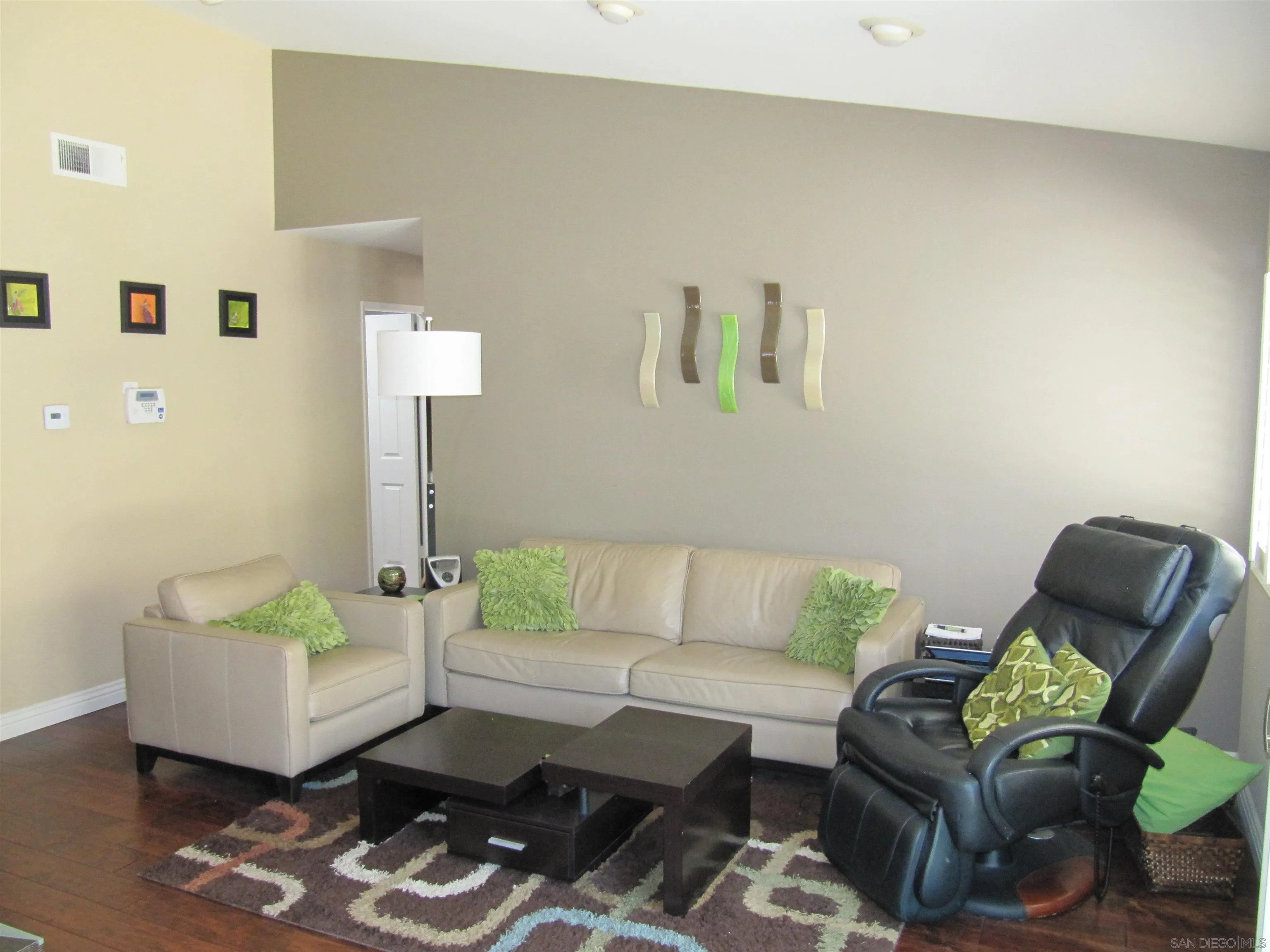 13236 Poway Hills Drive Poway, CA 92064 - Photo 9 of 19 a living room with furniture rug and wooden floor