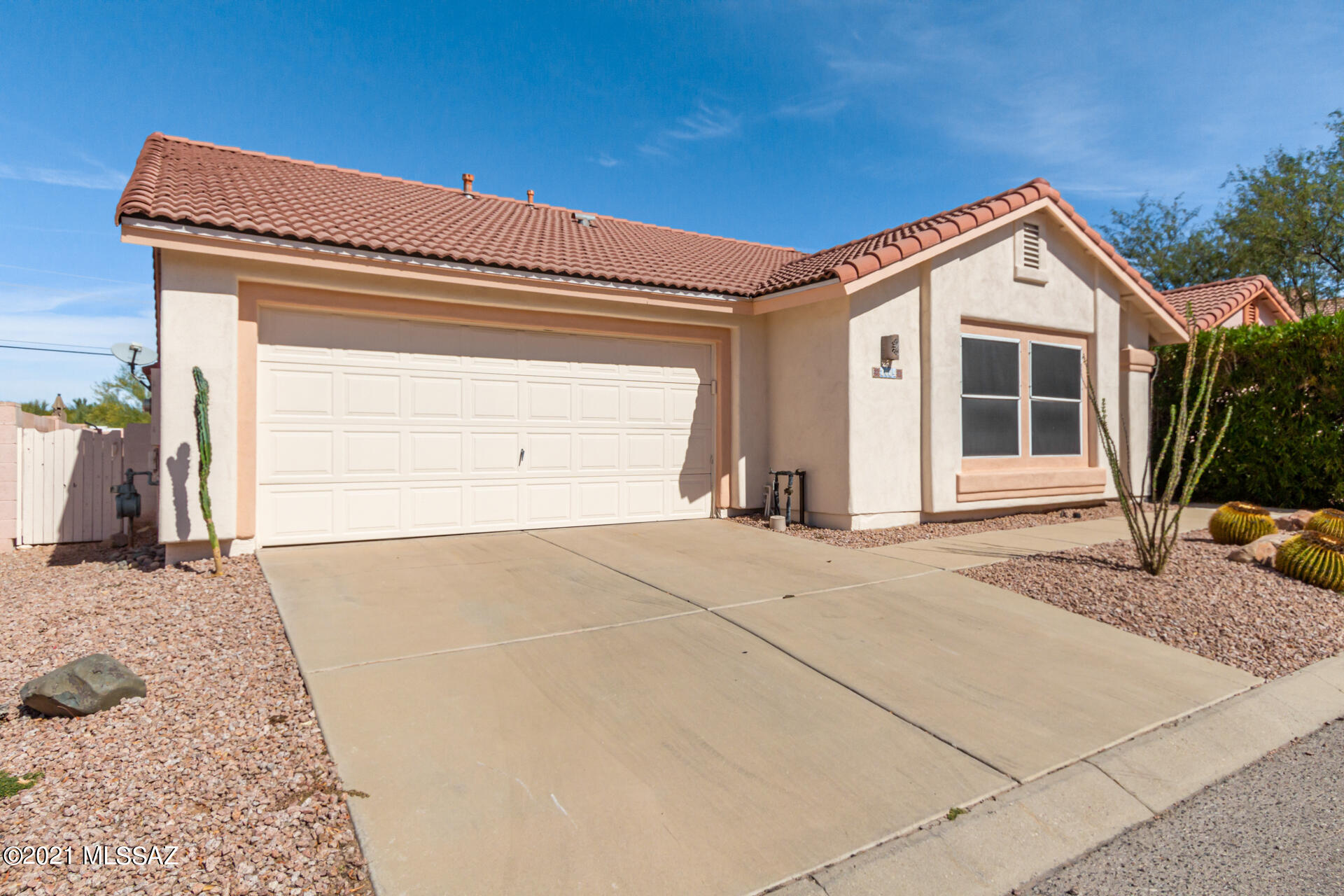 3034 West Sky Ranch Trail Tucson, AZ 85742 - Photo 2 of 27 a view of house with garage and yard