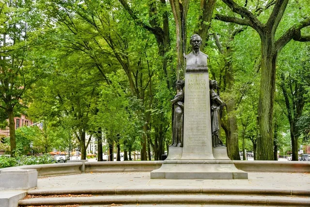 a view of a brick building next to a yard