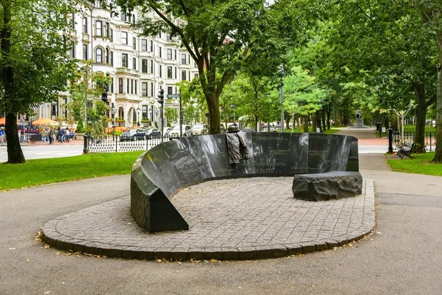 a white house with a yard and sitting area