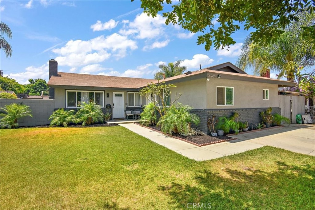 4363 Rudisill Street Montclair, CA 91763 - Photo 1 of 1 a front view of house with yard and trees around