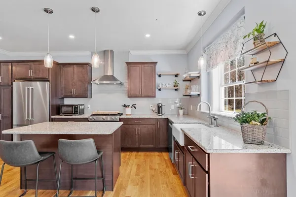 a large kitchen with granite countertop lots of counter top space