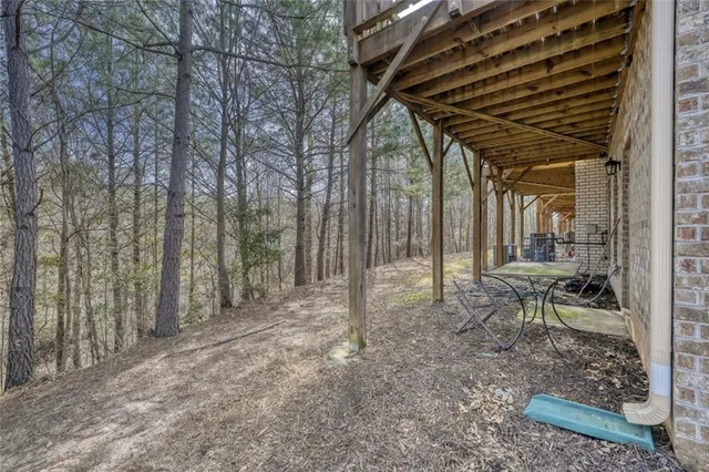 a view of two chairs in a backyard