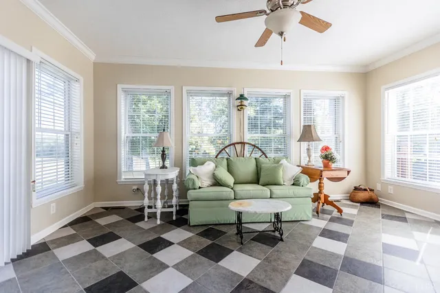 a kitchen with stainless steel appliances granite countertop a stove a sink and white cabinets