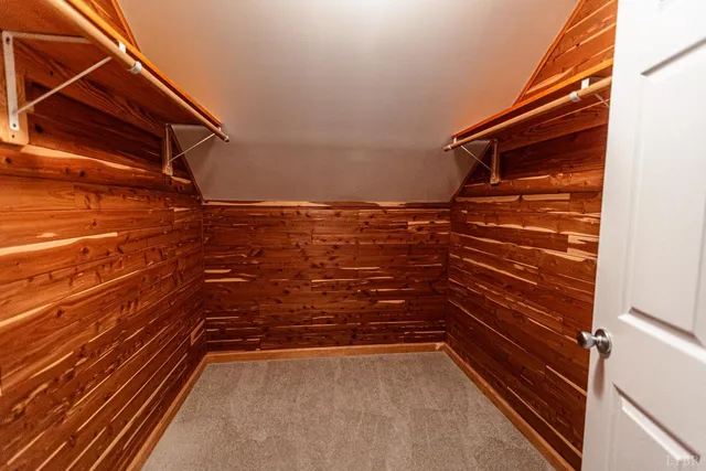 a view of a field with trees in the background