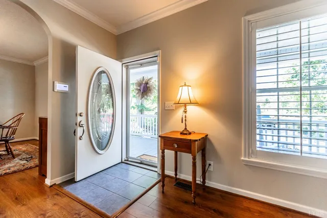 a living room with furniture fireplace and window
