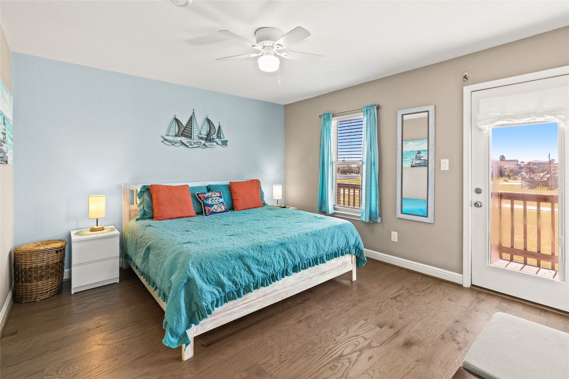 147 Pieces Of 8 Freeport, TX 77541 - Photo 16 of 33 a bedroom with a large bed and a chandelier
