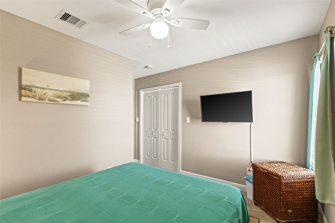 147 Pieces Of 8 Freeport, TX 77541 - Photo 21 of 33 a bedroom with a bed and a ceiling fan