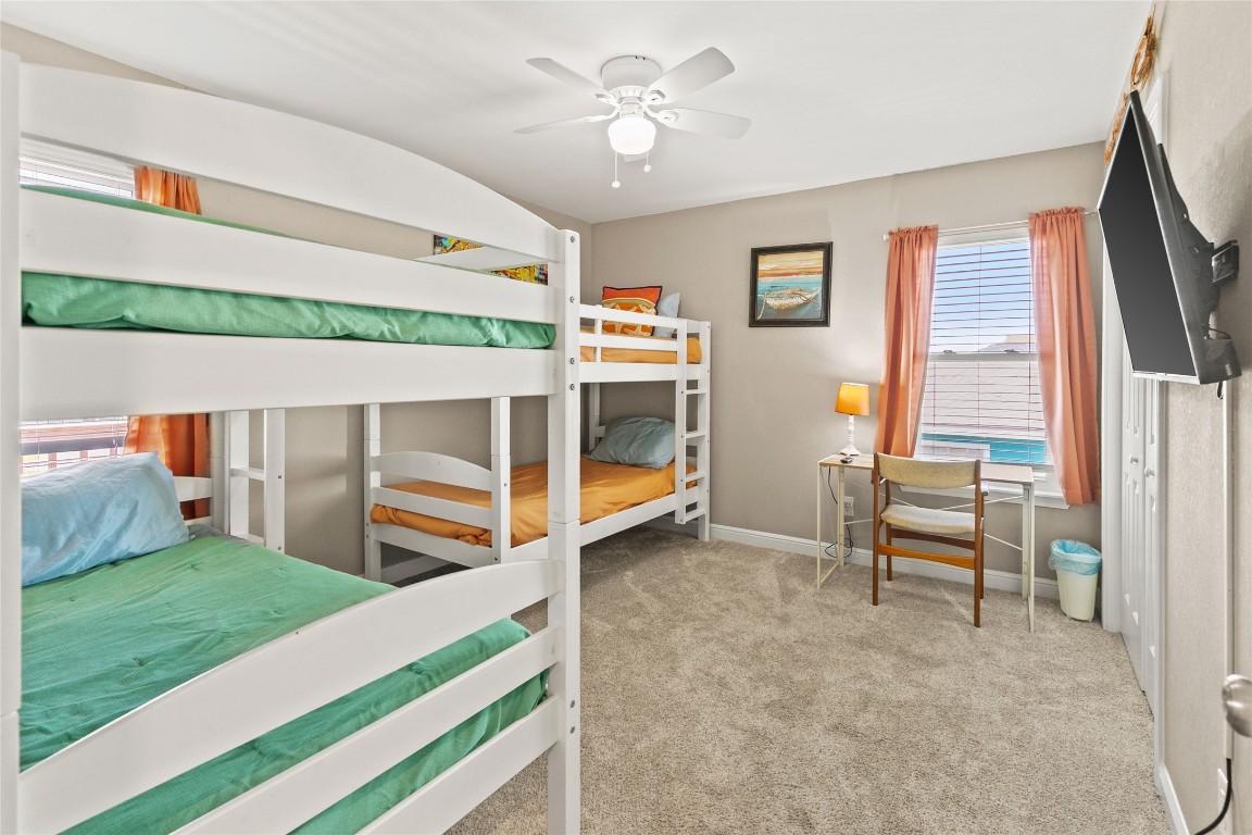 147 Pieces Of 8 Freeport, TX 77541 - Photo 22 of 33 a bedroom with furniture and a fireplace