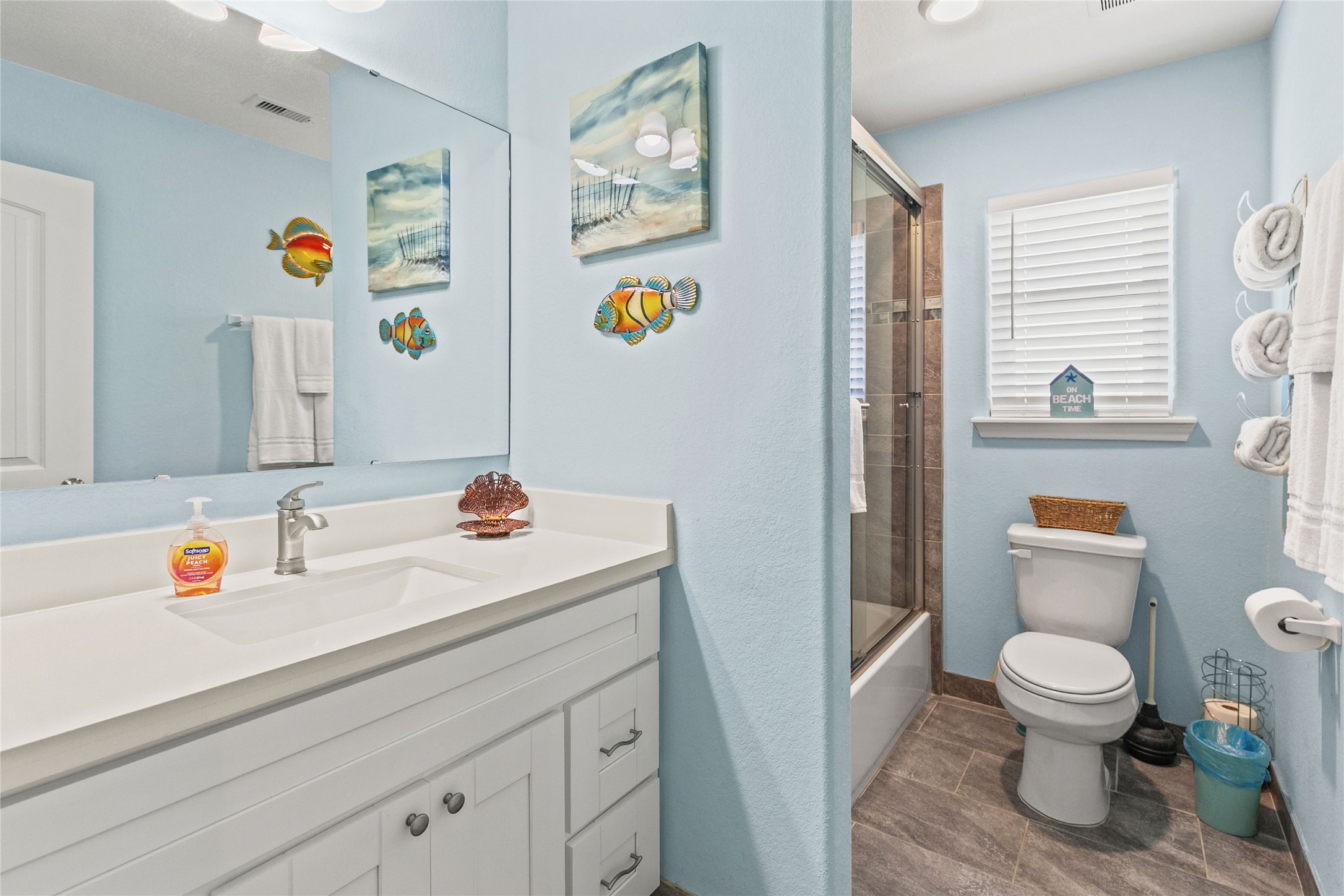 147 Pieces Of 8 Freeport, TX 77541 - Photo 24 of 33 a bathroom with a sink a toilet and a shower curtain