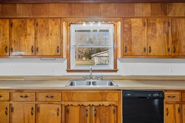 a view of a sink and a window