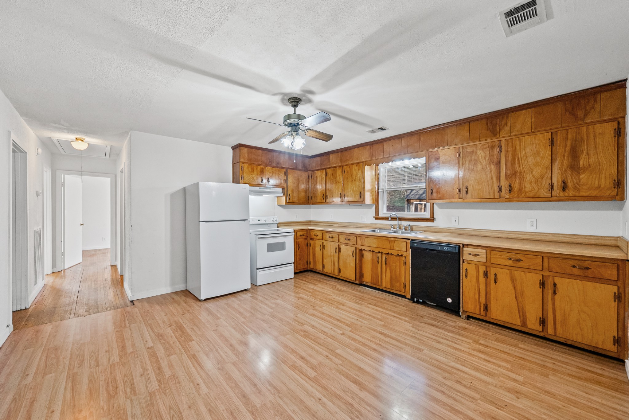1667 McWhorter Road Cunningham, TN 37052 - Photo 12 of 35 a open kitchen with stainless steel appliances granite countertop a stove cabinets and wooden floor