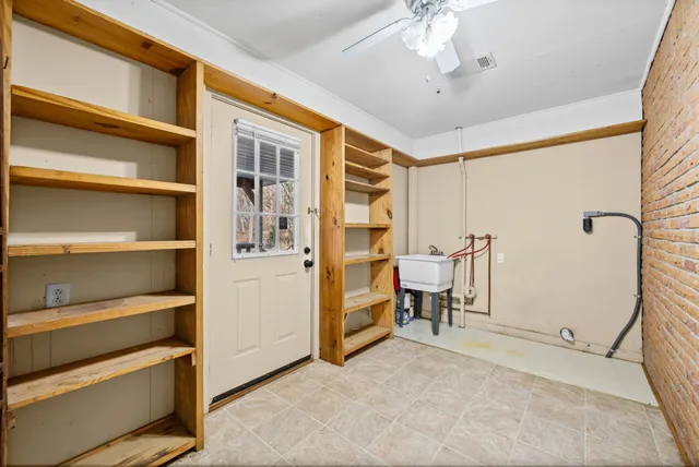a view of an empty room with a cabinet