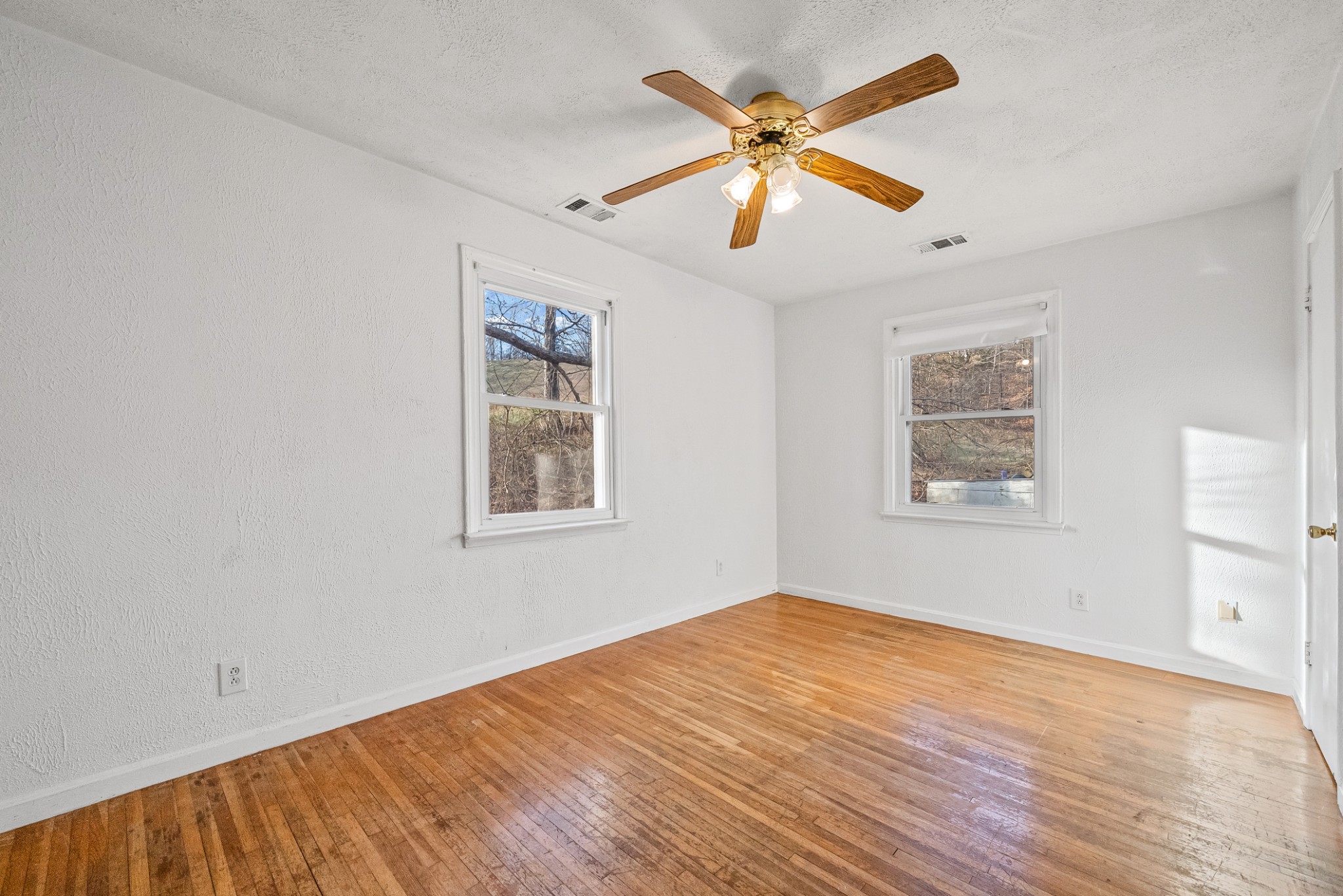 1667 McWhorter Road Cunningham, TN 37052 - Photo 21 of 35 a view of an empty room with wooden floor and a window