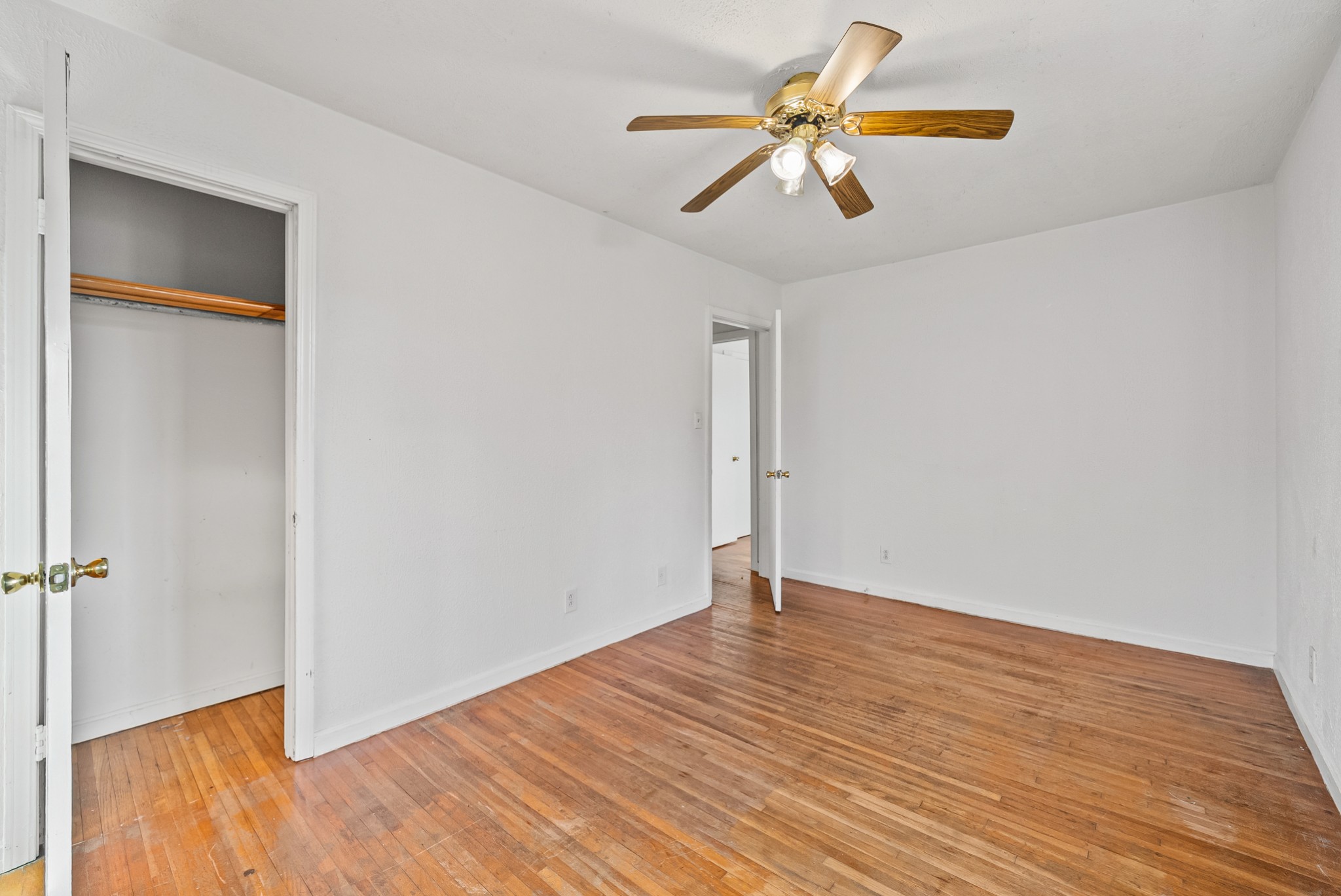 1667 McWhorter Road Cunningham, TN 37052 - Photo 22 of 35 an empty room with wooden floor closet and windows