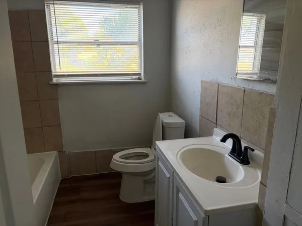 a bathroom with a sink and a window