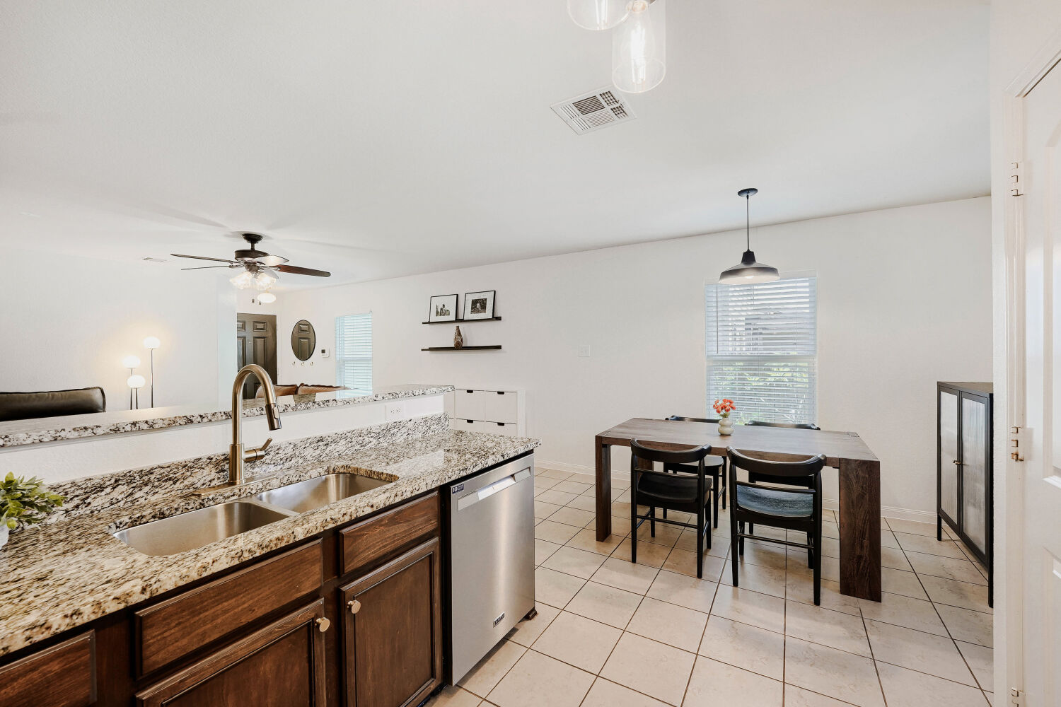 116 Millers Loop Jarrell, TX 76537 - Photo 9 of 23 A well-appointed kitchen and dining area provides ample space for entertaining and everyday living.