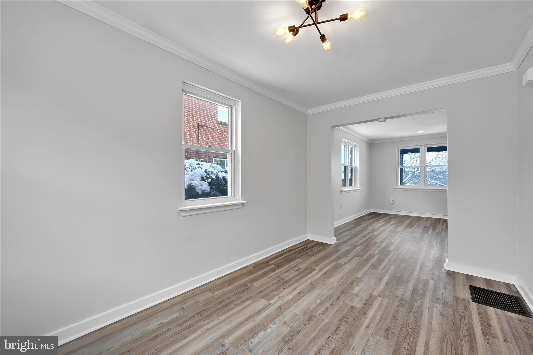 716 South Franklin Street Lancaster, PA 17602 - Photo 12 of 35 a view of an empty room with a window and wooden floor