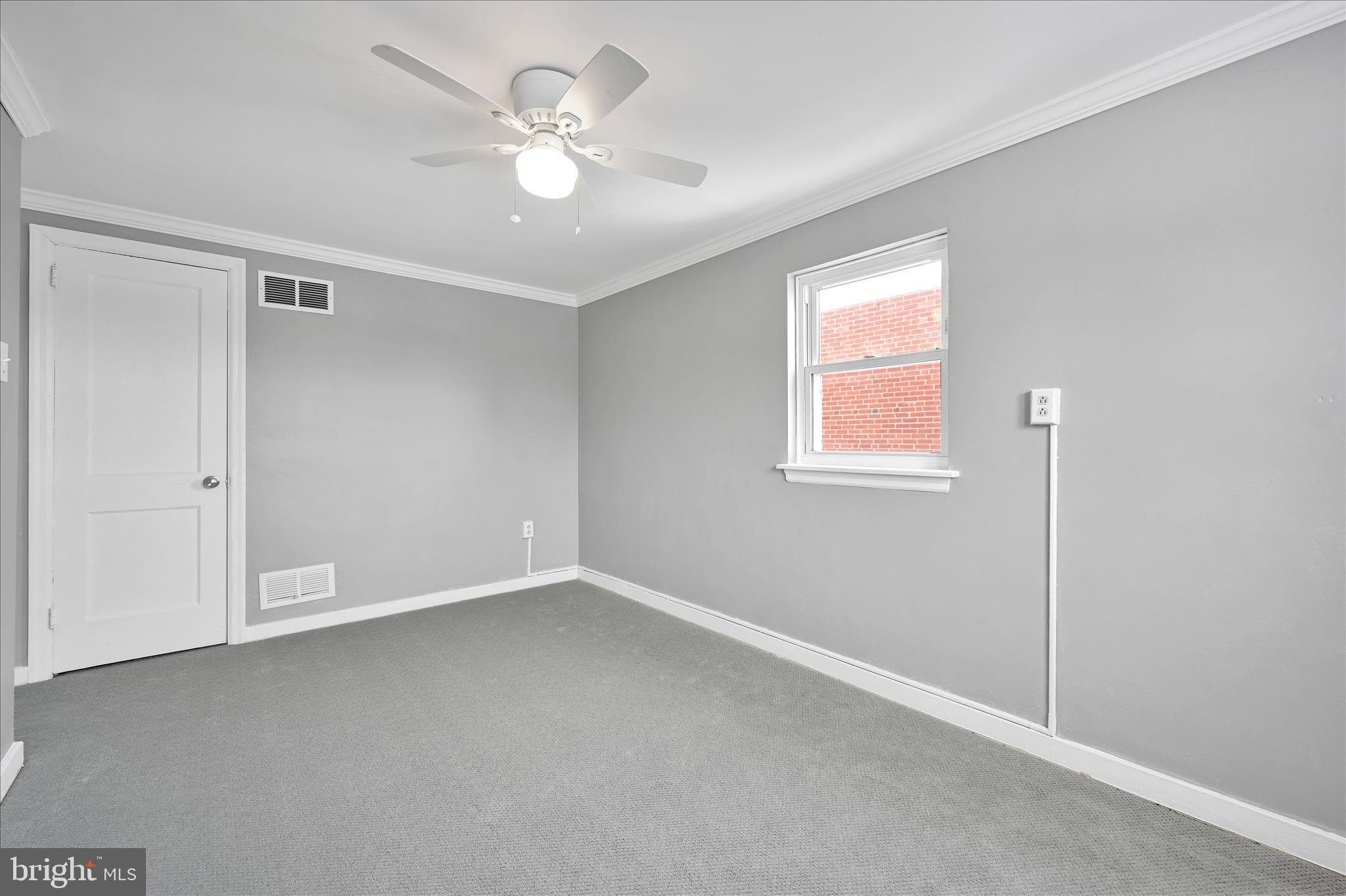 716 South Franklin Street Lancaster, PA 17602 - Photo 18 of 35 an empty room with a window and a fan