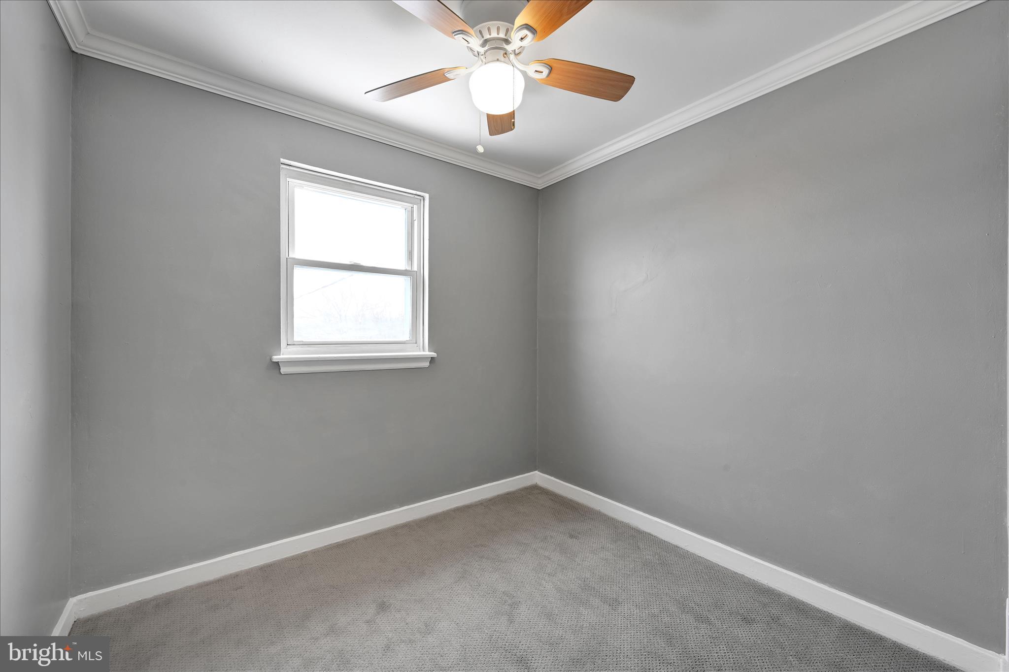 716 South Franklin Street Lancaster, PA 17602 - Photo 20 of 35 an empty room with a window and a fan