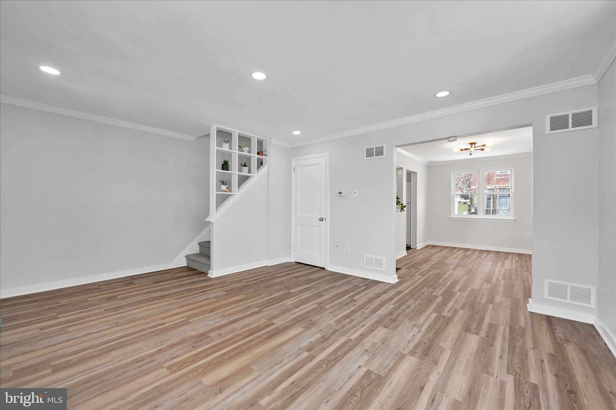 716 South Franklin Street Lancaster, PA 17602 - Photo 9 of 35 a view of an empty room with wooden floor and a window