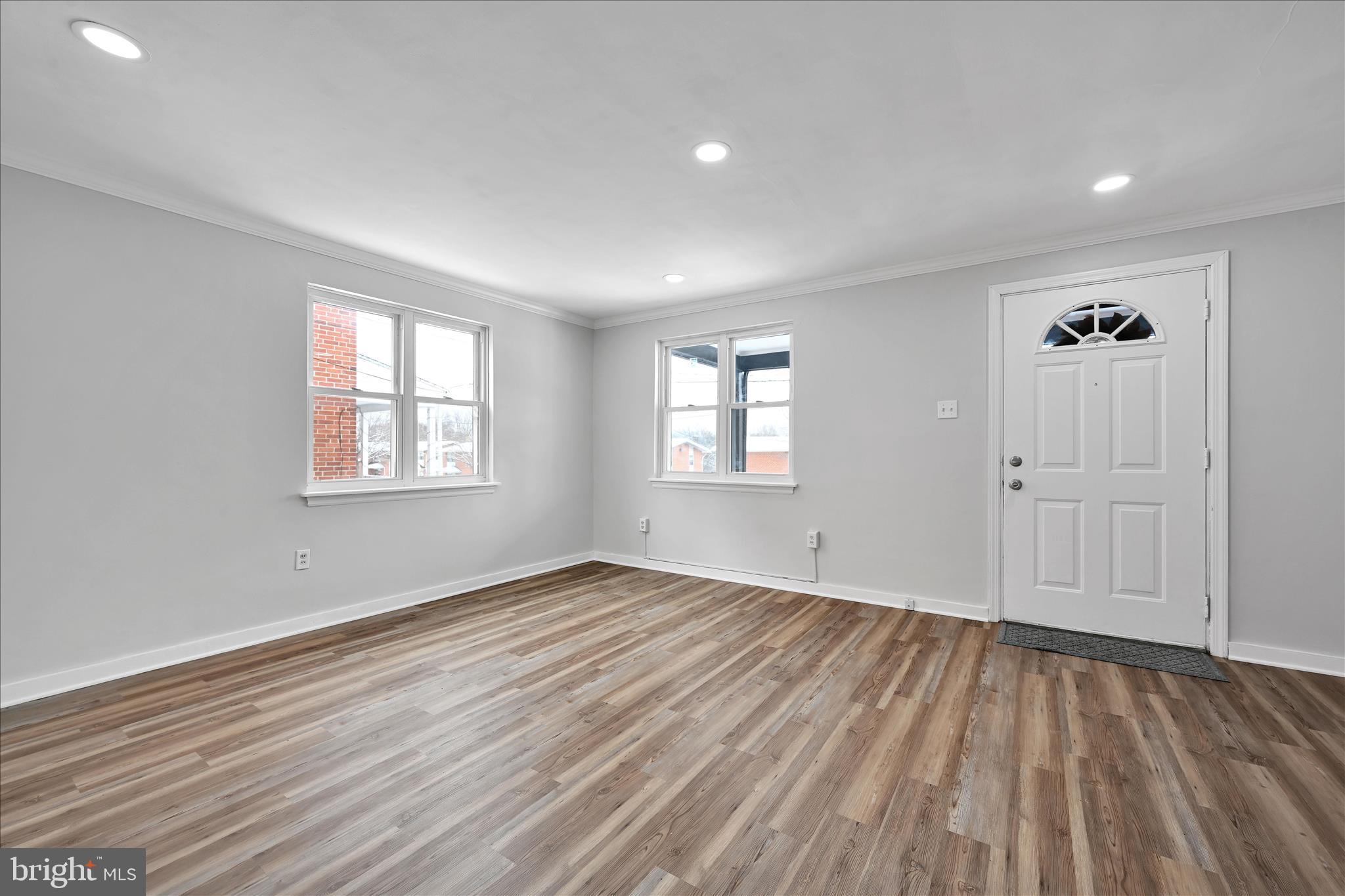 716 South Franklin Street Lancaster, PA 17602 - Photo 10 of 35 an empty room with wooden floor and windows