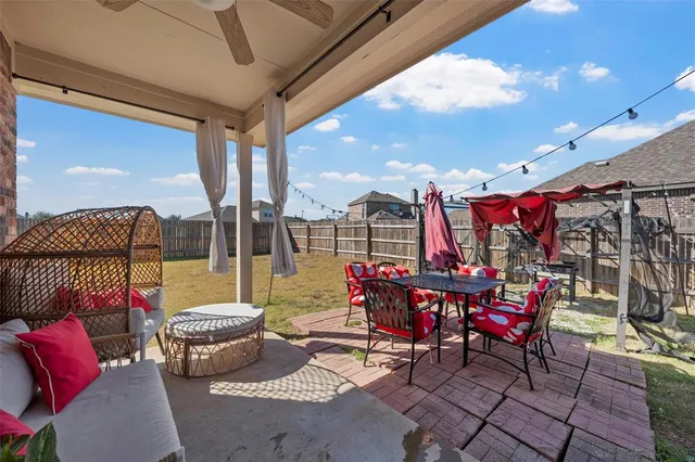 a view of a tables and chairs in patio