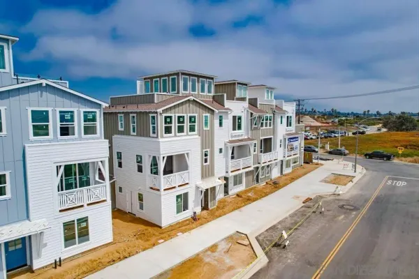 a front view of residential houses with street