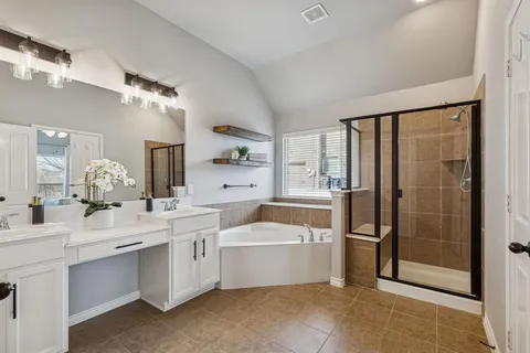 a room with a sink a washer and dryer